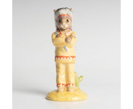 An indigenous figure wearing tribal clothing and head dress. Royal Doulton backstamp. Artist: K. CurtisIssued: 1999Dimensions