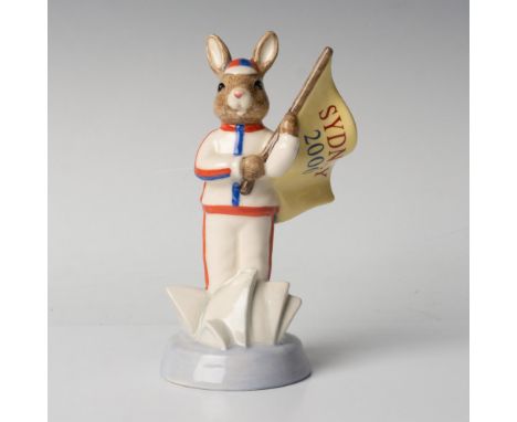 A sportsman wearing a red white and blue uniform and hat, holding a flag with the words Sydney 2000. Royal Doulton backstamp.