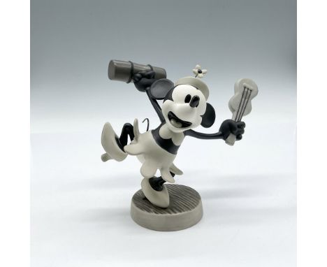 Collectors Society 10-year anniversary sculpture from Steamboat Willie figure is colored in black, white and gray holding her