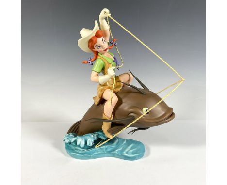 Annual Edition Melody Time American Folk Hero's porcelain figurine sitting atop a fish with her lasso extended. Colored in br