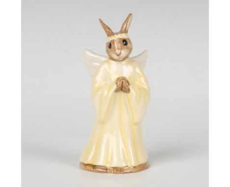 A figure of a heavenly bunny with wings, wearing a flowing yellow dress. This item comes with its original box: 3.5"L x 2.5"W