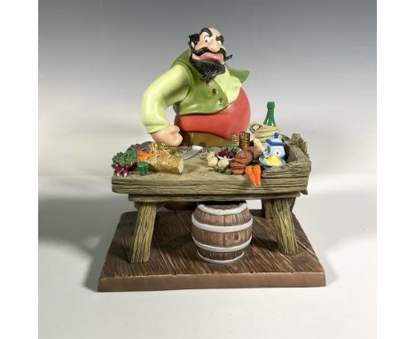 Porcelain figure is part of the Villains series, chef with his table looking angry. Colored in green, rust, black and brown. 