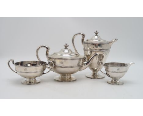 A GEORGE V FOUR PIECE SILVER TEA SERVICE by Lawson &amp; Co, Glasgow 1919, of baluster form, with banded decoration, the spou