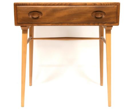 A MID 20TH CENTURY ERCOL ELM AND BEECH WRITING TABLE  rectangular top with single drawer with shaped drawer pulls on splayed 