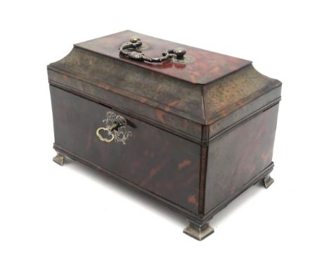 A GEORGE III TORTOISESHELL TEA CADDY Of rectangular form and standing upon white metal feet, each marked "IB", the hinged lid