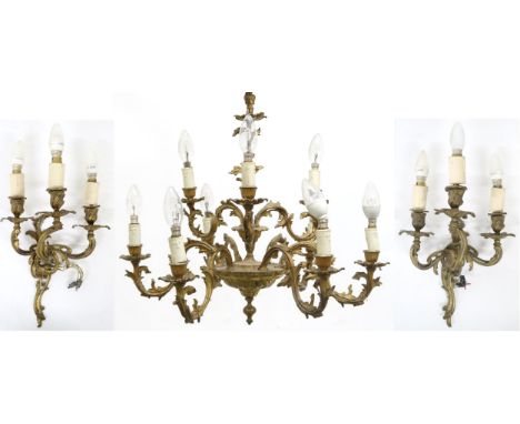 A CONTINENTAL ROCOCO STYLE GILT METAL CHANDELIER AND A PAIR OF WALL SCONCES&nbsp; chandelier with nine scrolled foliate arms,