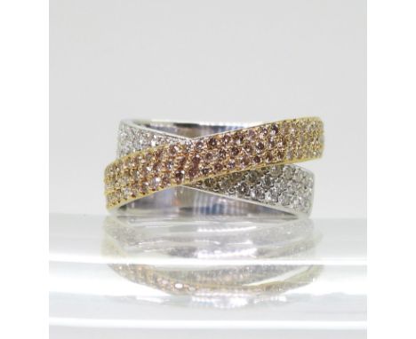 A STYLISH TWIST DIAMOND RING made in 18ct yellow and white gold and set with champagne and white diamonds. made by designer j