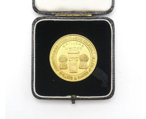 A 9ct GOLD SPILLERS LIMITED BAKING PRESENTATION MEDAL Cast By the Alexander Clark Co. Ltd., Birmingham, 1932, weighing 29.32g