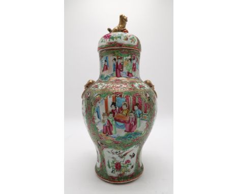 A CANTONESE BALUSTER VASE AND COVER Painted with panels of figures, birds, flowers and insects,divided by a gilt and scroll p