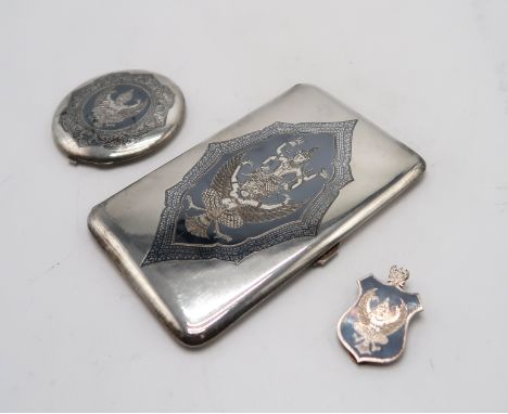 A THAI SILVER ILNAID CIGARETTE CASE by F.W Margrett &amp; Co, of rectangular form, depicting Garuda carrying Vishnu, a simila