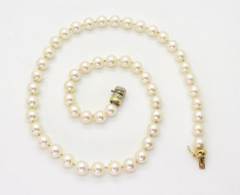 A STRING OF PEARLS creamy pink in colour, each pearl approx 7.2mm, length 47.5cm, with a diamond set 18ct gold barrel clasp w