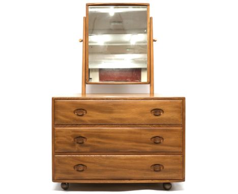 A MID 20TH CENTURY ERCOL ELM AND BEECH DRESSING CHEST  with adjustable dressing mirror over three long drawers with shaped dr