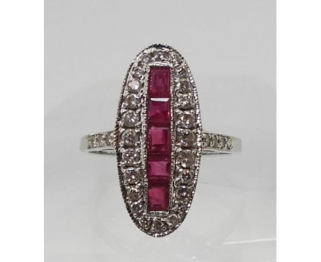 A RUBY AND DIAMOND PANEL RING mounted in 18ct white gold, finger size N, weight 3.9gms Condition Report:Available upon reques