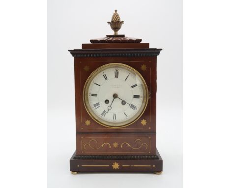 A FRENCH MAHOGANY MANTEL CLOCK the case with inlaid brass details, and pineapple finial, the movement marked with Medaille D'