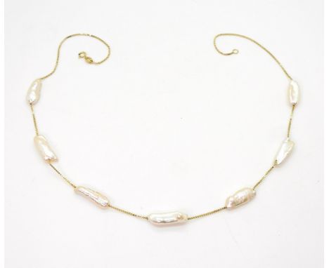 AN 18K GOLD PEARL NECKLACE from the Jewellery Channels premier Brand Illiana, an 18k gold box chain strung with six Grade 5A'