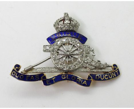 A ROYAL ARTILLERY SWEETHEART BROOCH made in yellow and white metal, with blue and red enamel detail and rose cut diamonds set
