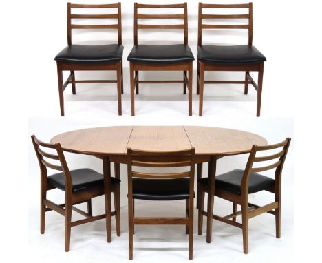 A MID 20TH CENTURY TEAK EXTENDING DINING TABLE AND SIX CHAIRS&nbsp; with circular extending top over internal leaf on shaped 