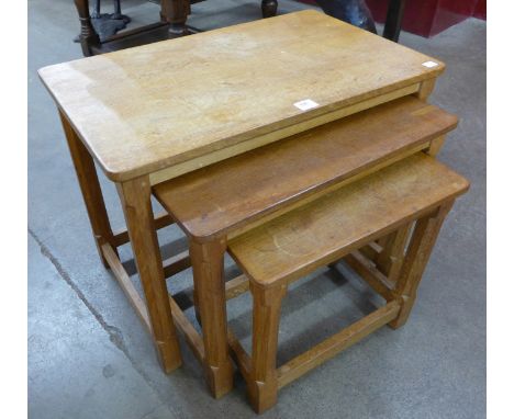An oak nest of tables by Robert 'Mouseman' Thompson