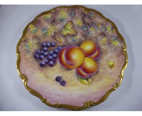 CABINET PLATE HAND PAINTED FRUIT , SIGNED G.DELANEY (EX ROYAL WORCESTER) WITH SHAPED GILT BORDER, APPROX. 26 cm DIA.