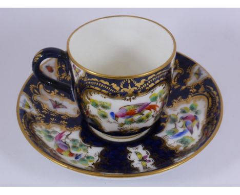 ROYAL WORCESTER BLUE AND GILT CUP AND SAUCER, BIRD AND BUTTERFLY DECORATION, JOHN PINNICK COLLECTION