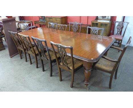 A Victorian style mahogany extending dining table and a harlequin set of eleven Chippendale style dining chairs