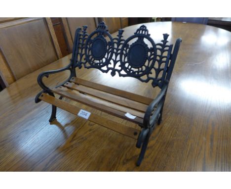 A miniature cast iron bench