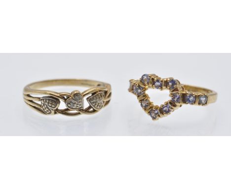 Two hallmarked 9ct gold dress rings. The rings including a stylised diamond set band ring having diamond set heart motifs, si