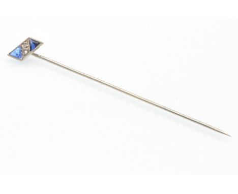 A French 18ct white gold and platinum stick pin. The pin having triangular mixed cut sapphires with central rose cut diamonds