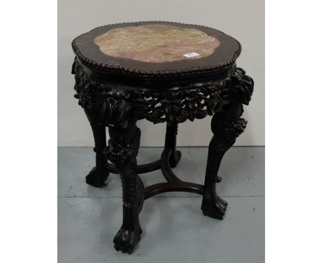 Victorian Chinese Hardwood Lamp Table, with a button detailed circular shaped top, inset with red marble, over heavily carved