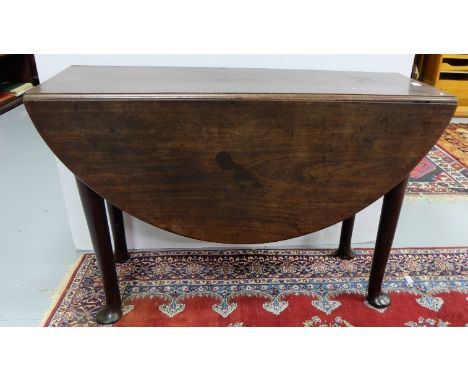 Georgian Mahogany Gate-leg Table, with oval shaped drop sides, on turned legs, pad feet, 42”w x 45”w (extended)