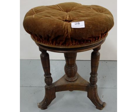 Arts and Crafts Revolving Piano Stool, labelled “Thomas Fry & Co, Sackville St, Dublin”, brown button seat, cabriole legs