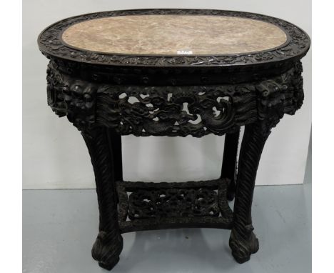 Mid-19thC Intricately Carved Oval Chinese Cherrywood Centre Table, the red and white marble top surrounded by musical and flo