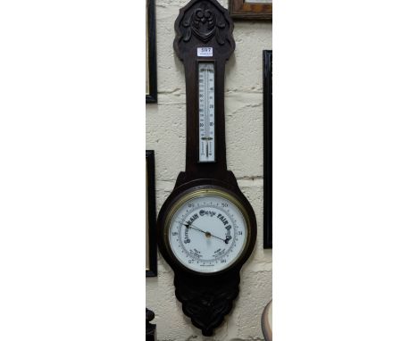 English Aneroid Barometer in carved oak case & a 1950’s walnut cased mantle clock (2)