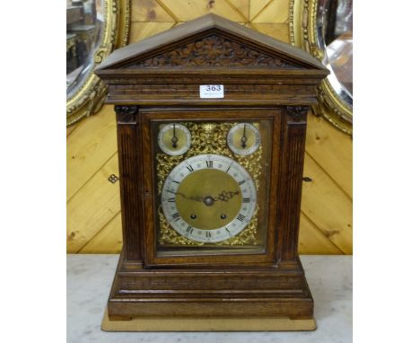 Edwardian Oak Cased Bracket Clock, with doric columns and an engraved brass and silvered dial and Westminster Chime, 15”w x 1