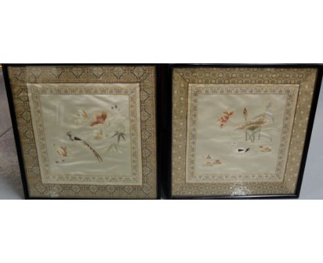 Pair of 20thC Chinese needlework Birds on silk panels, woven tapestry surrounds, in black frames, each 15” sq 
