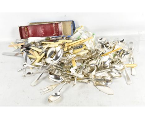 A group of mixed loose silver plated flatware.