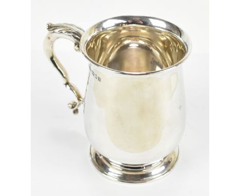 ASPREY; a George V hallmarked silver mug, with loop handles and spreading circular foot, London 1927, height 10cm, approx 6.9