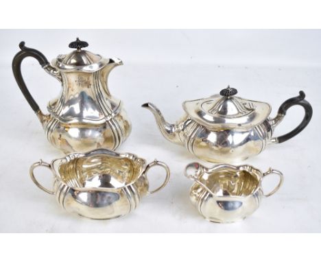 FENTON BROS LTD; an Edward VII hallmarked silver four piece tea set of shaped outline comprising teapot, length 30.5cm, hot w