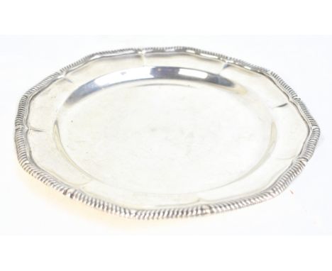 THOMAS BRADBURY &amp; SONS; a Victorian hallmarked silver circular tray with shaped gadrooned rim, London 1899, with further 