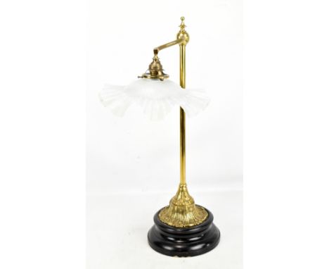 A brass Victorian style table lamp with glass floral shade on raised circular wooden base, height 64cm.Additional Information