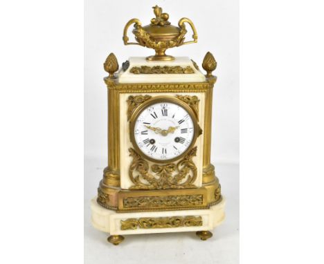 A late 19th century French white marble gilt metal mounted mantel clock, the white enamel dial set with Roman numerals, inscr