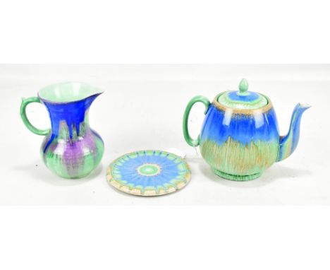 SHELLEY; a 'Harmony' drip wear teapot on stand and cream jug, printed marks to bases, height of jug 14.6cm.Additional Informa
