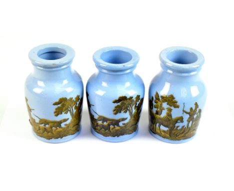 A set of three Victorian Pratt type pale blue ground grease jars, each transfer decorated with hunting scenes, heights approx