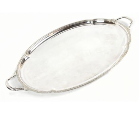 OLLIVANT &amp; BOTSFORD; an Elizabeth II hallmarked silver twin handled oval tray, Sheffield 1958, length 56.5cm, approx 55.8