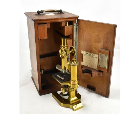 LEITZ VETZLER; a brass monocular microscope, serial number 34659, with three lenses, three slides and further accessories, pa