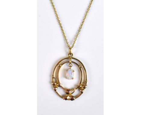 A 9ct yellow gold pierce oval pendant centred with an opal suspended on a 9ct fine link chain approx 4.3g.