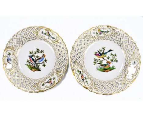 MEISSEN; a pair of early 20th century hand painted cabinet plates with pierced borders and painted panels depicting birds in 