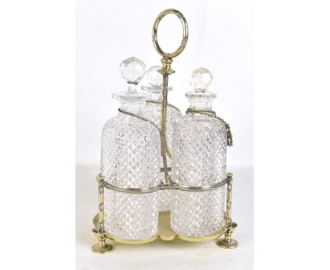 A late Victorian silver plated three bottle tantalus, with hobnail cut oval decanters, height 32cm.Additional InformationNo, 