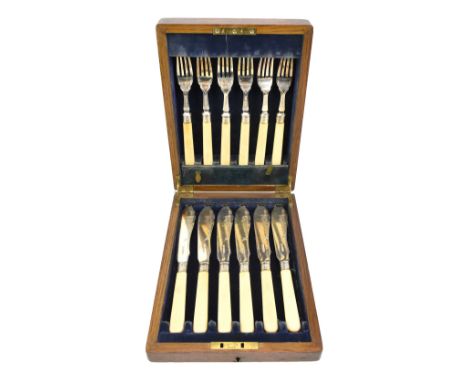 B WORTH &amp; SONS; a cased George V hallmarked silver fish set comprising six knives and forks with ivory handles, Sheffield