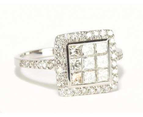 An 18ct white gold diamond step cluster ring totalling approx 1.75cts and with nine main stones, size M, approx 3.4g.